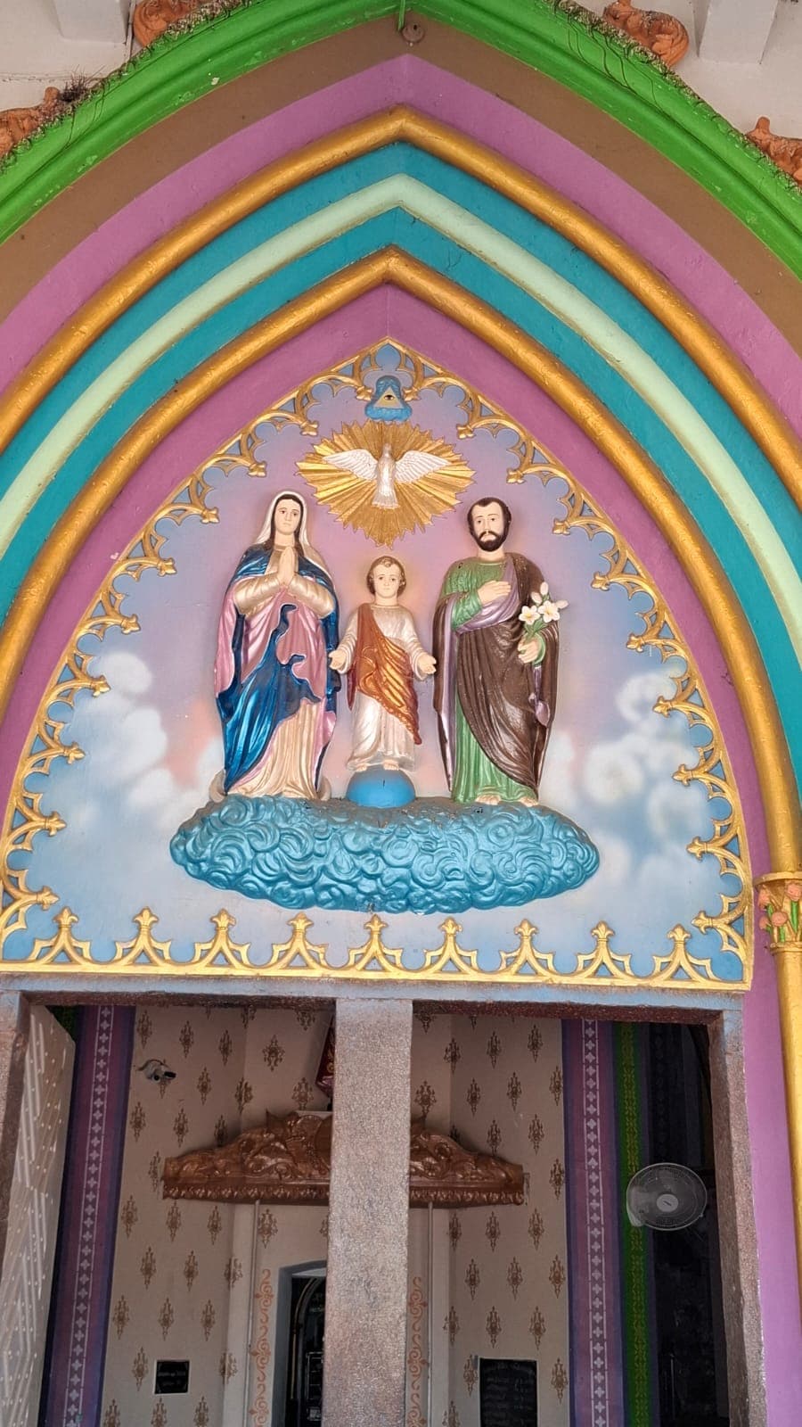 The Holy Family sculpture group above the main entrance of the church